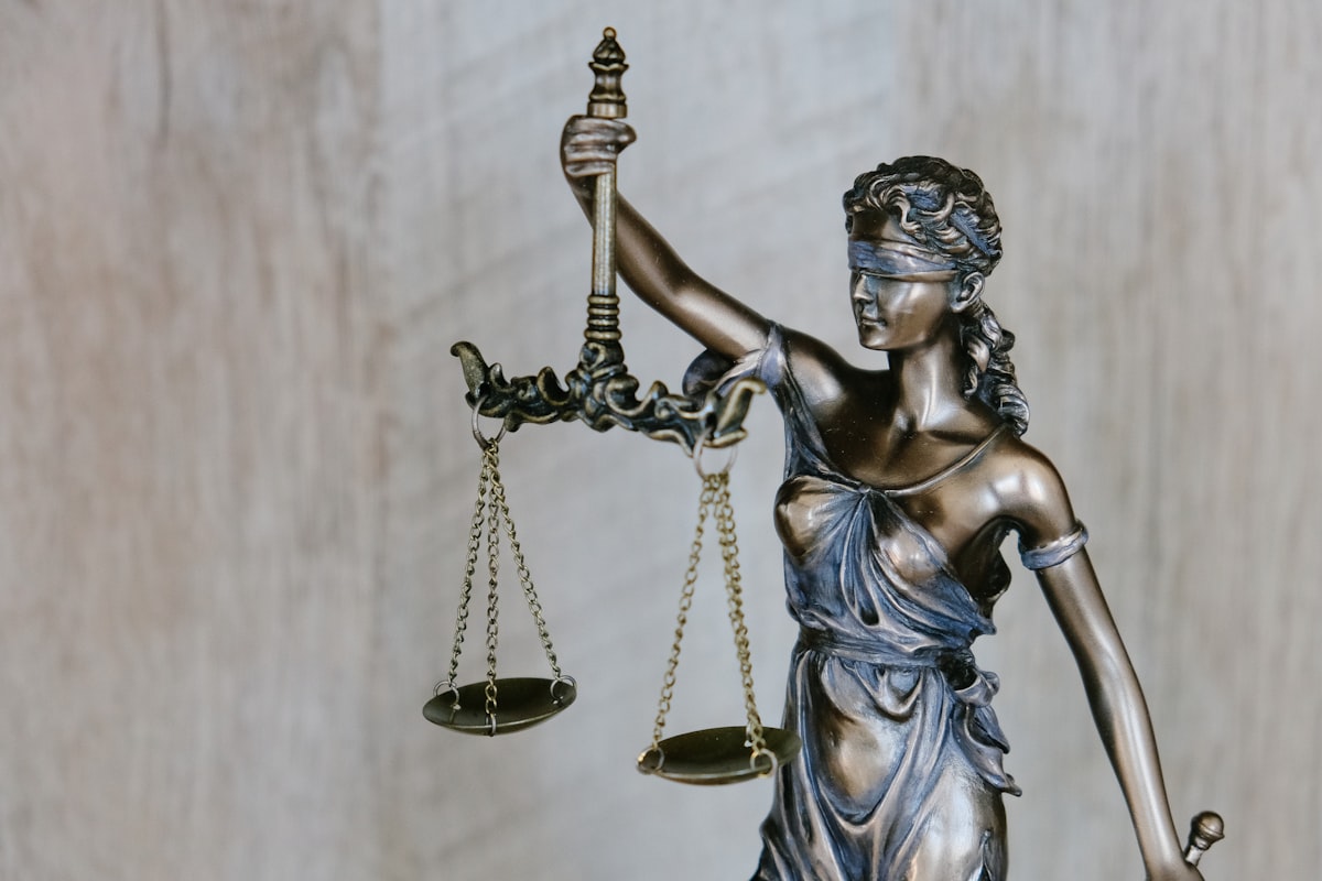 Generic Unsplash stock photo of a wooden judge's gavel resting on a desk, used to illustrate the Sherman Act legal analysis in this post — not a photo from this case or any actual court proceeding