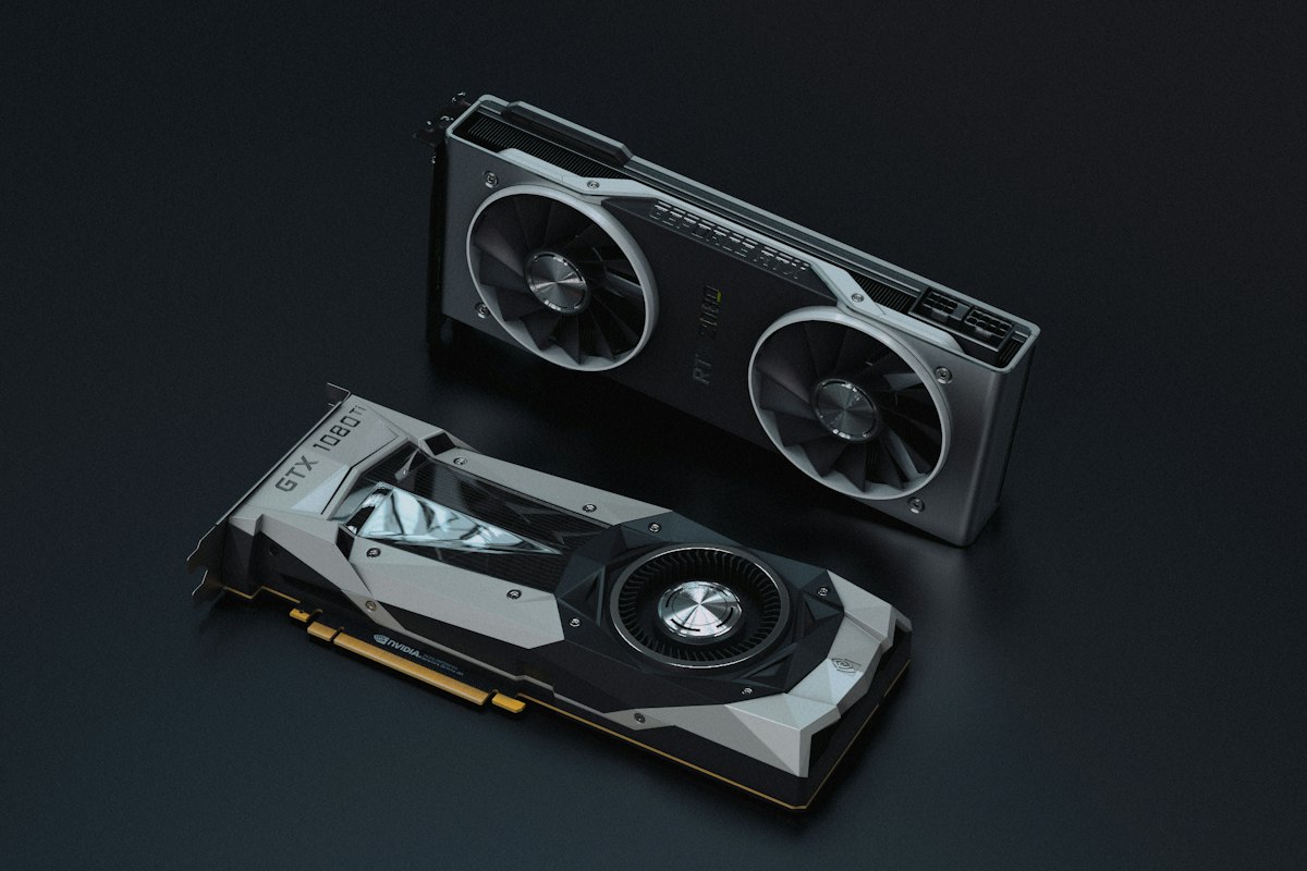 Two NVIDIA consumer graphics cards (a GTX 1080 Ti and an RTX 2080) lying on a dark studio surface — generic stock photo representing AI-serving hardware, not an actual photo of DeepSeek-V4.1-Flash, Reflection Beam, or of any benchmark run