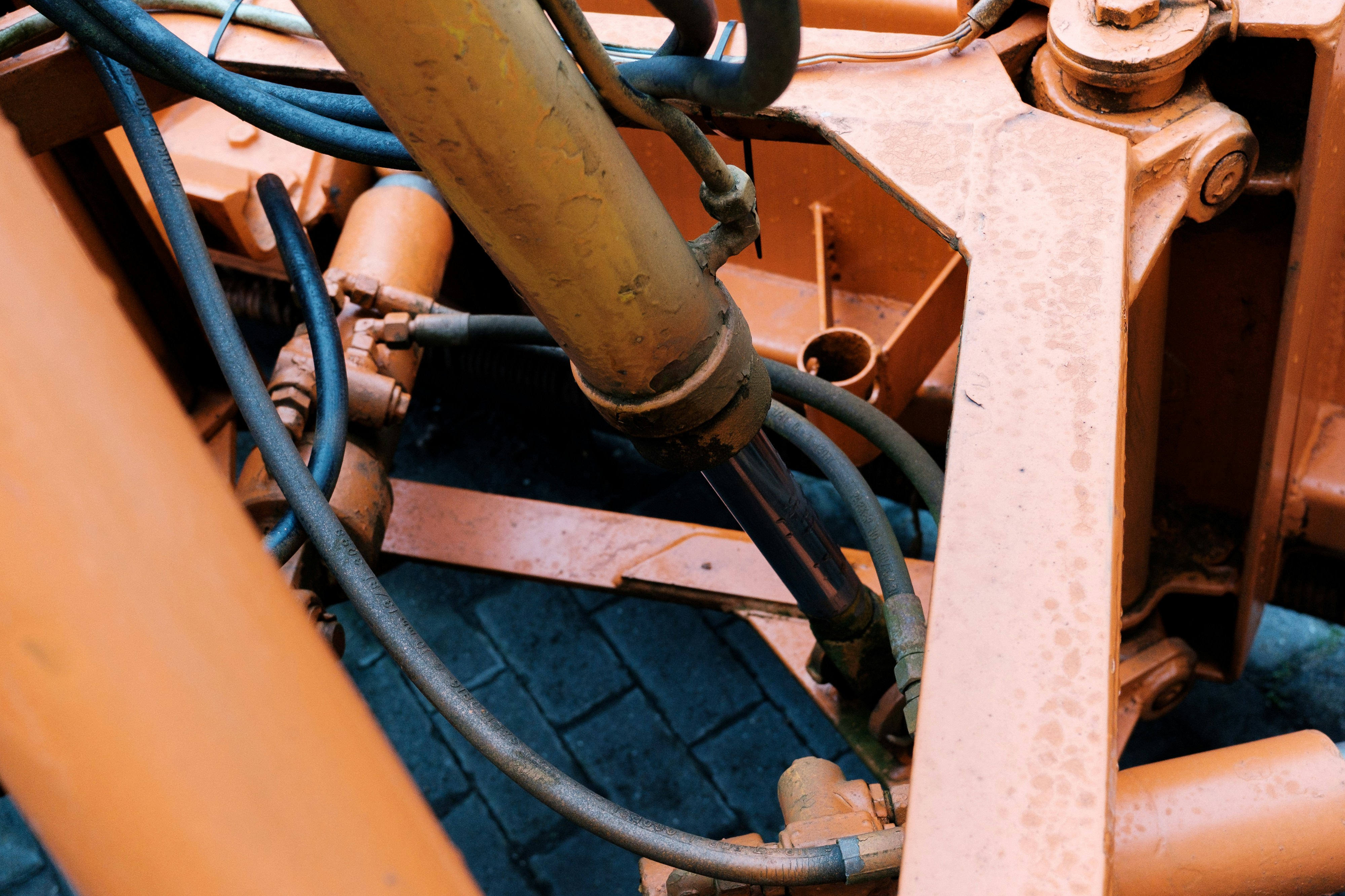 Close-up of a John Deere proprietary ECU and locked diagnostic port, illustrating why farmers research John Deere repair alternatives